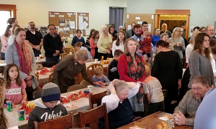 Parishioners gather for an early Thanksgiving potluck before the Advent fast begins.